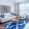 Living room with large windows and ample natural lighting at Pavilion at Lake