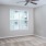 Bedroom with carpet and ceiling fan in apartments at Pavilion at Lake Apartments
