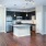 Living room and kitchen with wood-style flooring