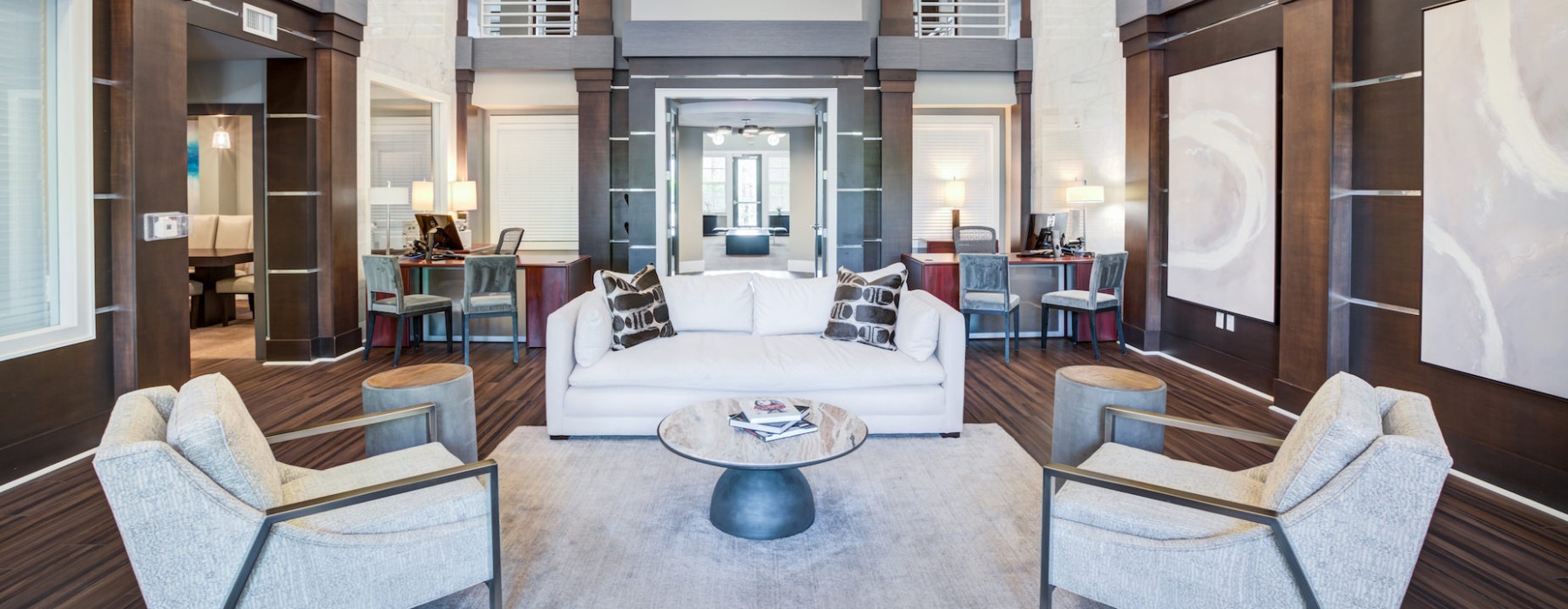 room with white couch and chairs